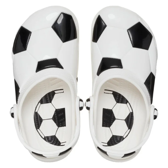 White sandals with black and white soccer ball pattern on a white background