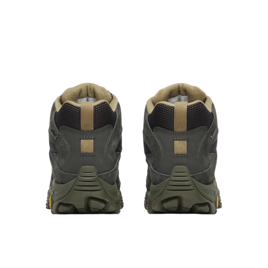 Pair of green hiking boots on a white background
