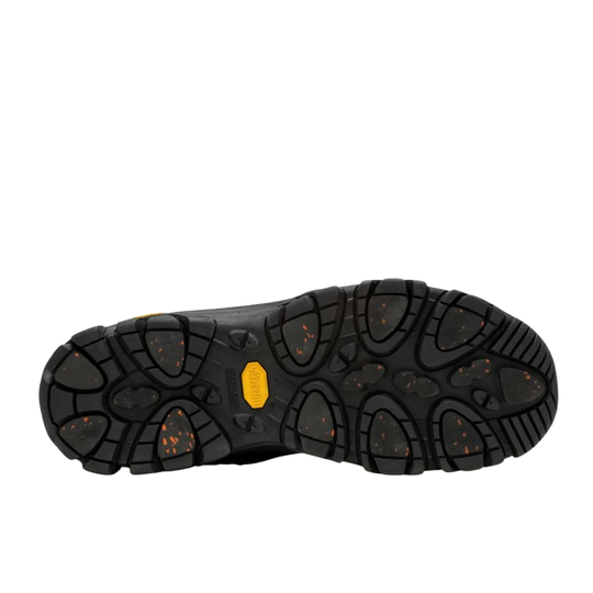 Close-up of a black shoe sole with a yellow vibram label on a white background