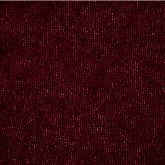 Close-up of a textured burgundy fabric surface