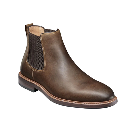 Brown leather Chelsea boot on a white background