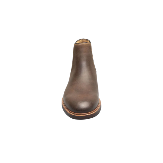Brown leather boot on a white background