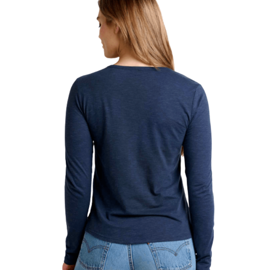 Person wearing a blue long-sleeve shirt and jeans on a white background