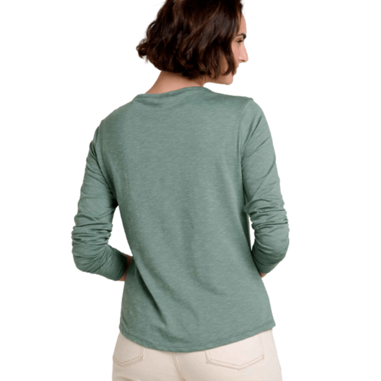 Woman wearing a green long-sleeve shirt on a white background
