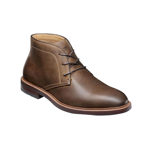 Brown leather chukka boot on a white background