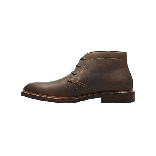 Brown leather boot on a white background
