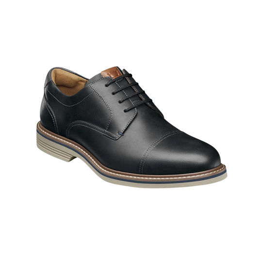 Black leather dress shoe on a white background