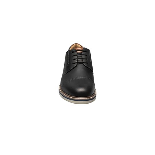 Black leather dress shoe on a white background