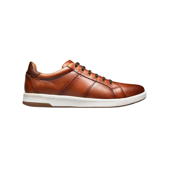 Brown sneaker with brown accents on a white background