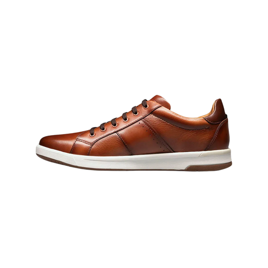 Navy blue sneaker with brown lining on a white background