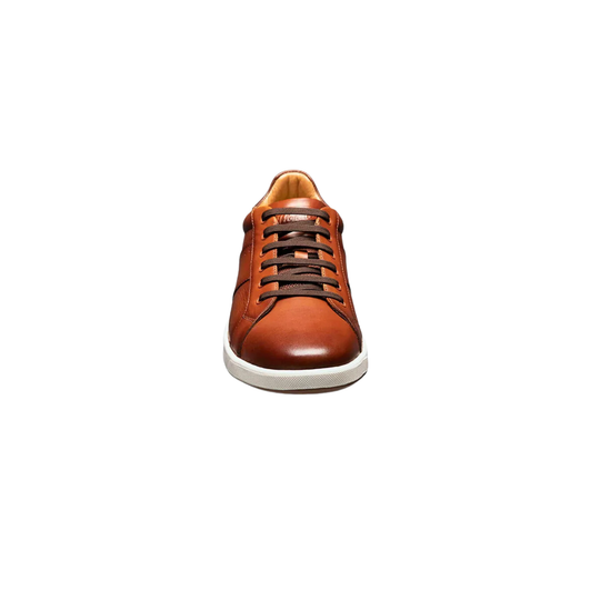 Brown leather sneaker on a white background