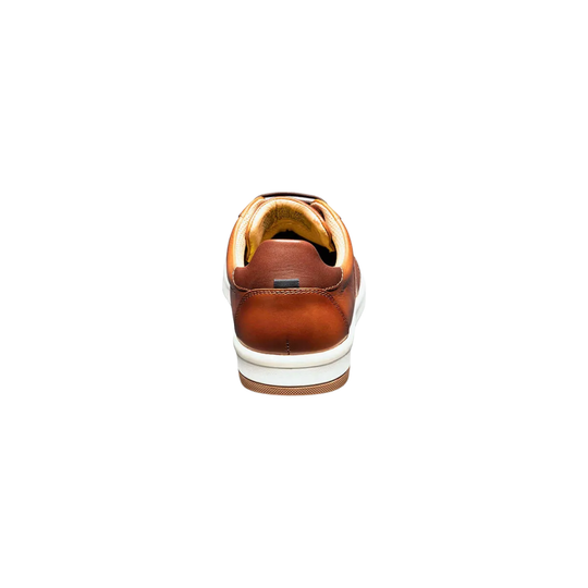 Brown leather shoe with white sole on a white background