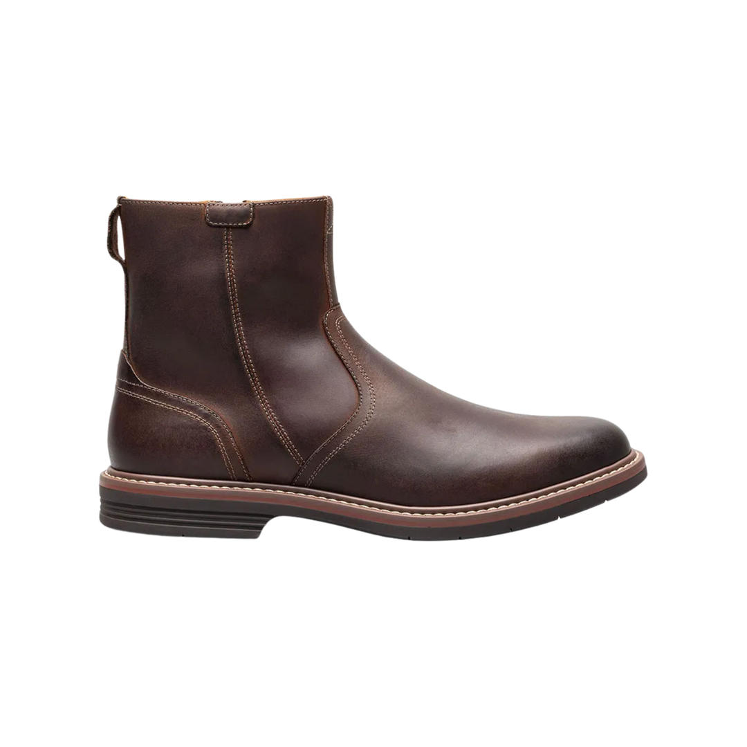 Brown leather boot on a white background