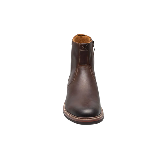 Brown leather boot on a white background
