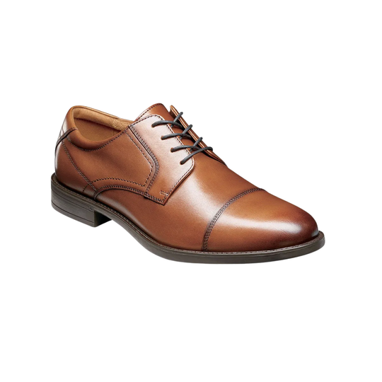 Brown leather dress shoe on a white background