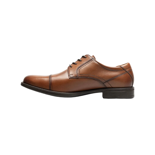 Brown leather dress shoe on a white background