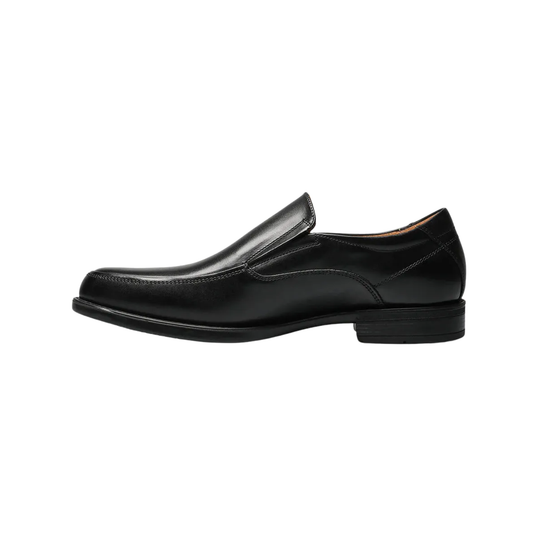 Slip on black shoe on a white background