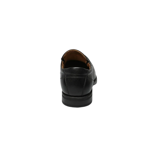 Slip on black shoe on a white background