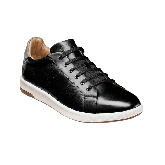 Black leather sneaker with white sole on a white background