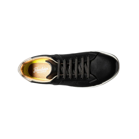 Black sneaker with visible brand logo on a white background