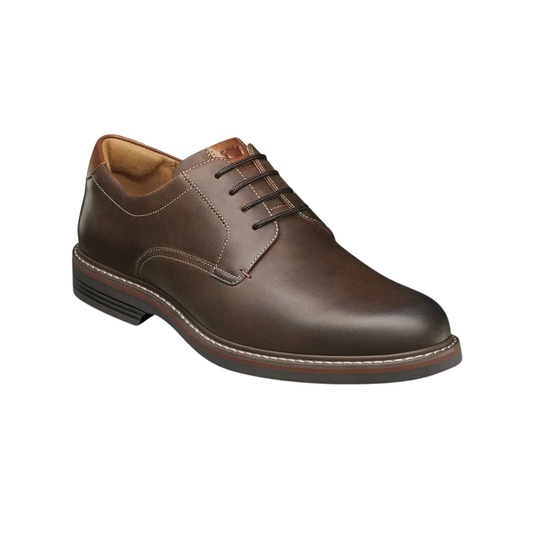 Brown leather dress shoe on a white background