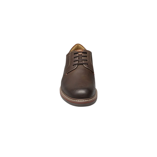 Brown leather shoe on a white background