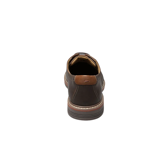 Brown leather shoe on a white background
