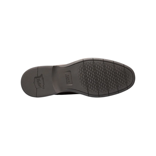 Brown leather bottom of dress shoe on a white background