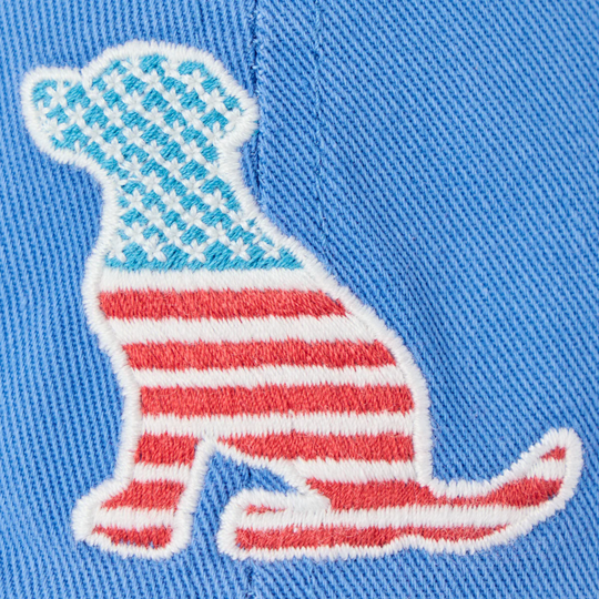 Embroidered dachshund with American flag pattern on a blue fabric background