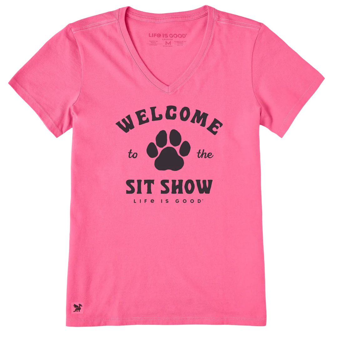 Pink t-shirt with black paw print graphic and text on a white background