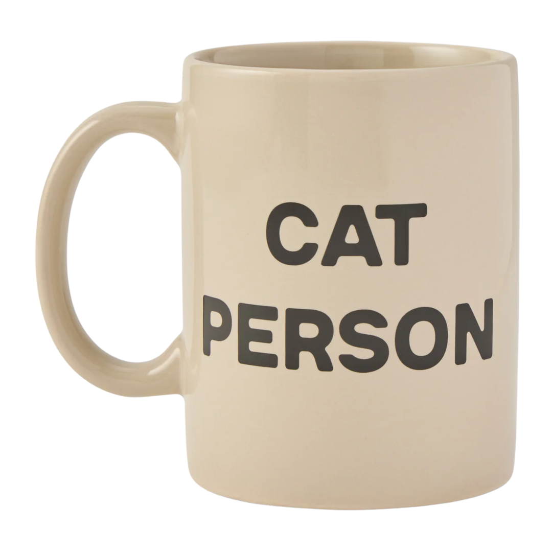 Beige mug with 'CAT PERSON' text on a white background