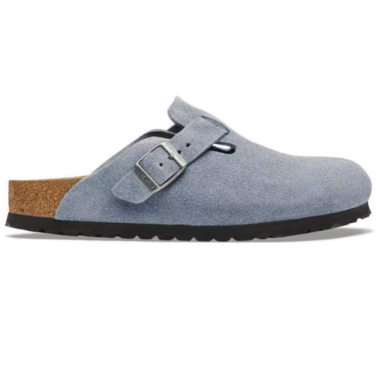 Blue suede clog shoe with a brown sole on a white background