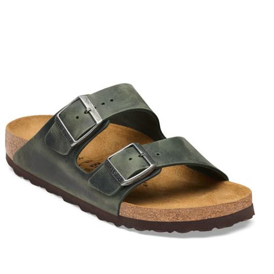 Green sandal with cork sole on a white background