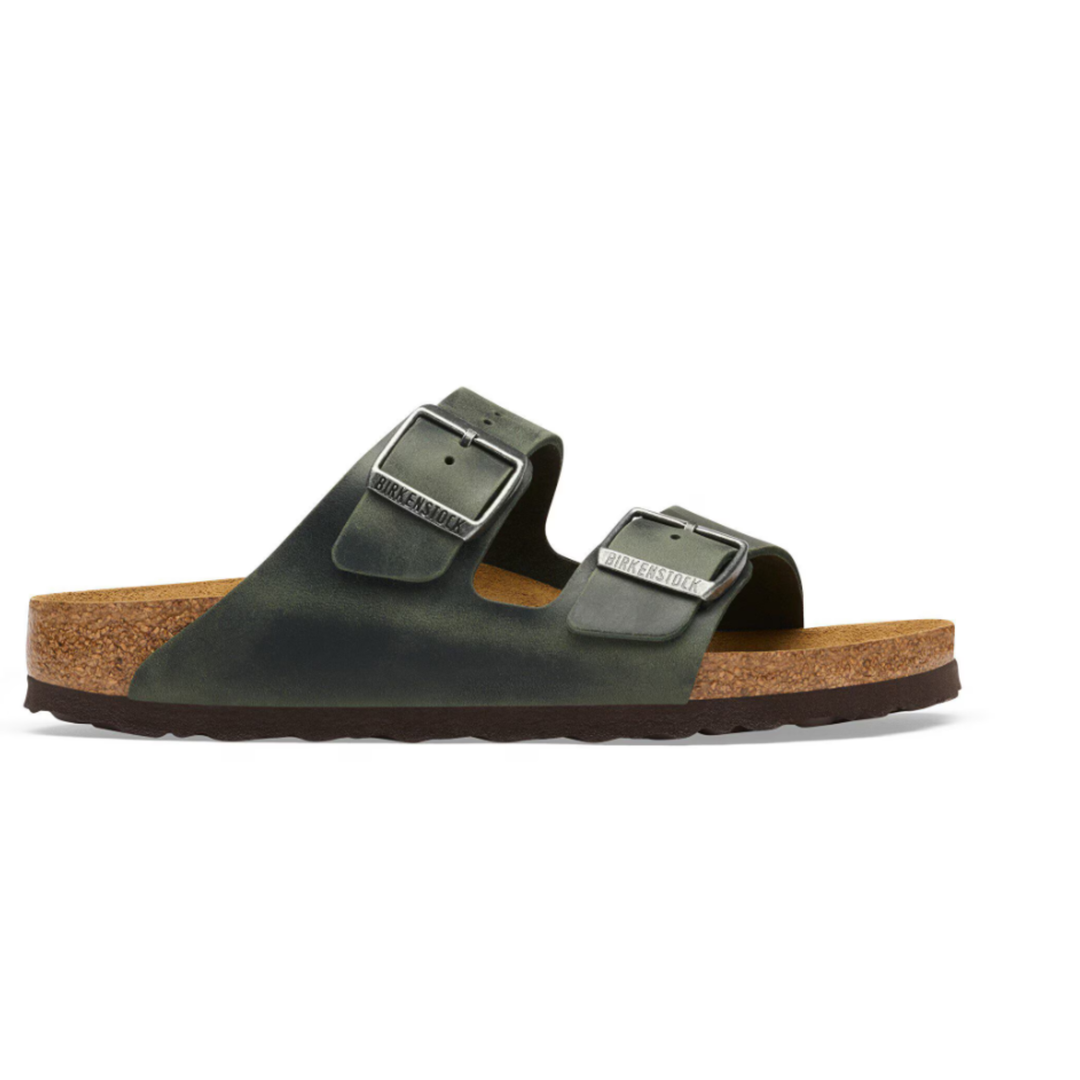Green sandal with cork sole on a white background