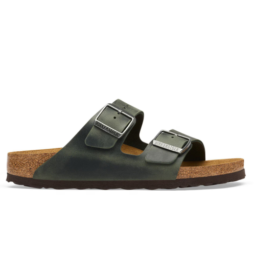 Green sandal with cork sole on a white background