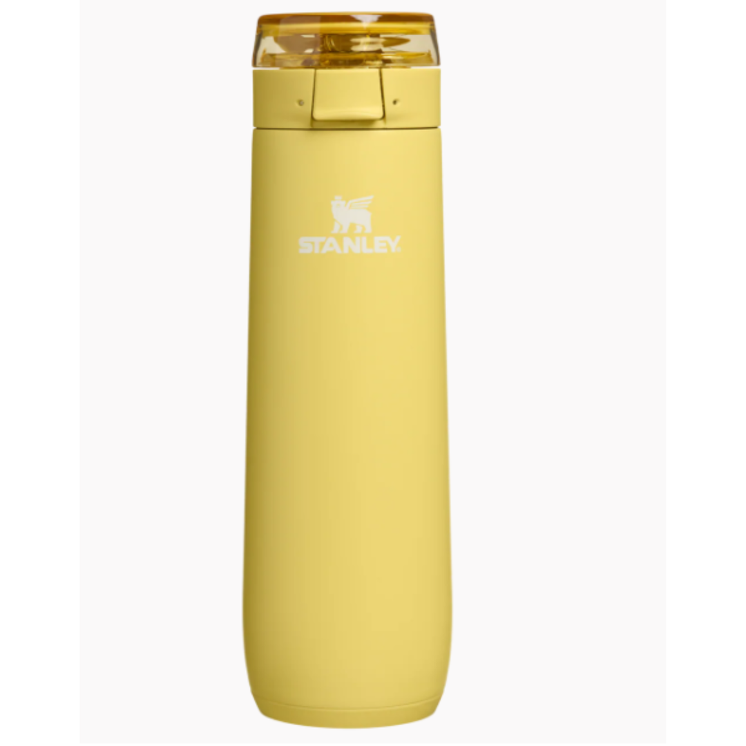 Yellow Stanley water bottle on a white background