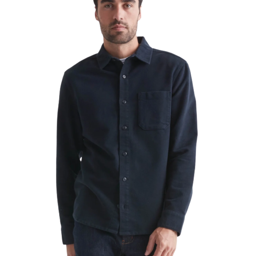 Man wearing a navy blue button-up shirt on a white background