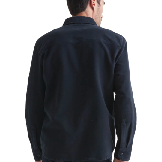 Man wearing a dark blue shirt on a white background