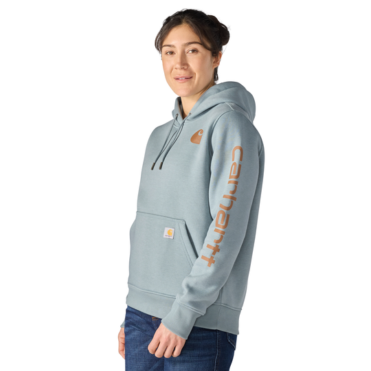 Person wearing a light blue hoodie with a brand logo on a white background