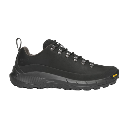 Black sneaker with textured sole on a white background