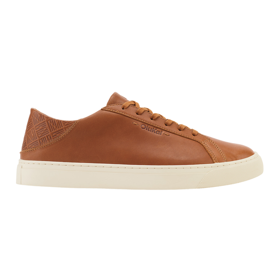 Brown sneakers with white soles on a light gray background