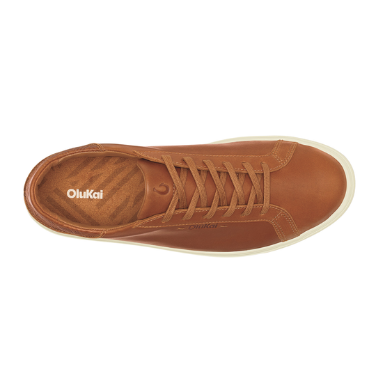 Brown sneaker with 'OluKai' branding on a white background