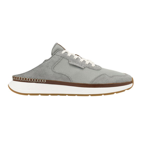 Gray sneaker with white laces on a white background