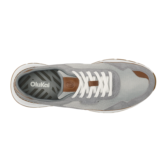 Gray sneaker with white laces on a white background