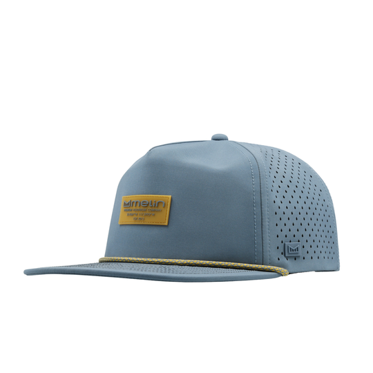 Blue cap with a yellow patch on a white background