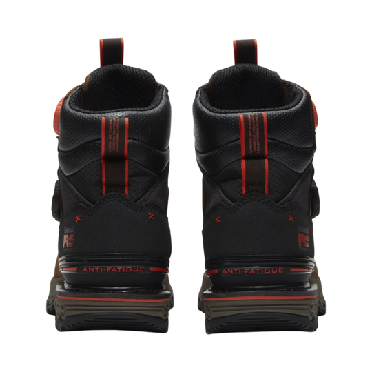 Black work boots with red accents on a white background