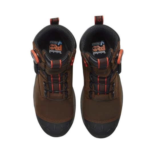 Pair of brown boots with black soles on a white background