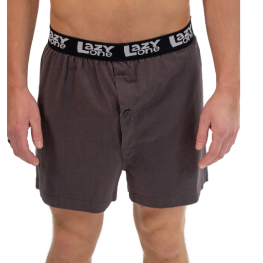 Person wearing grey shorts with a Lazy One waistband on a white background