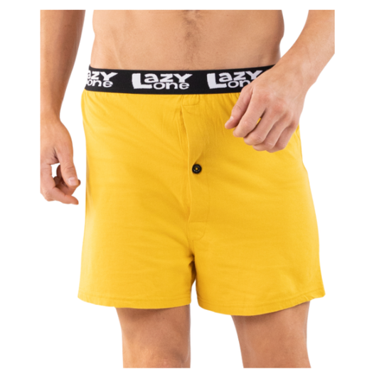 Yellow boxer shorts with a black waistband featuring 'Lazy One' brand on a white background.