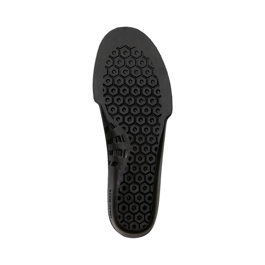 Black shoe sole with hexagonal pattern on a white background